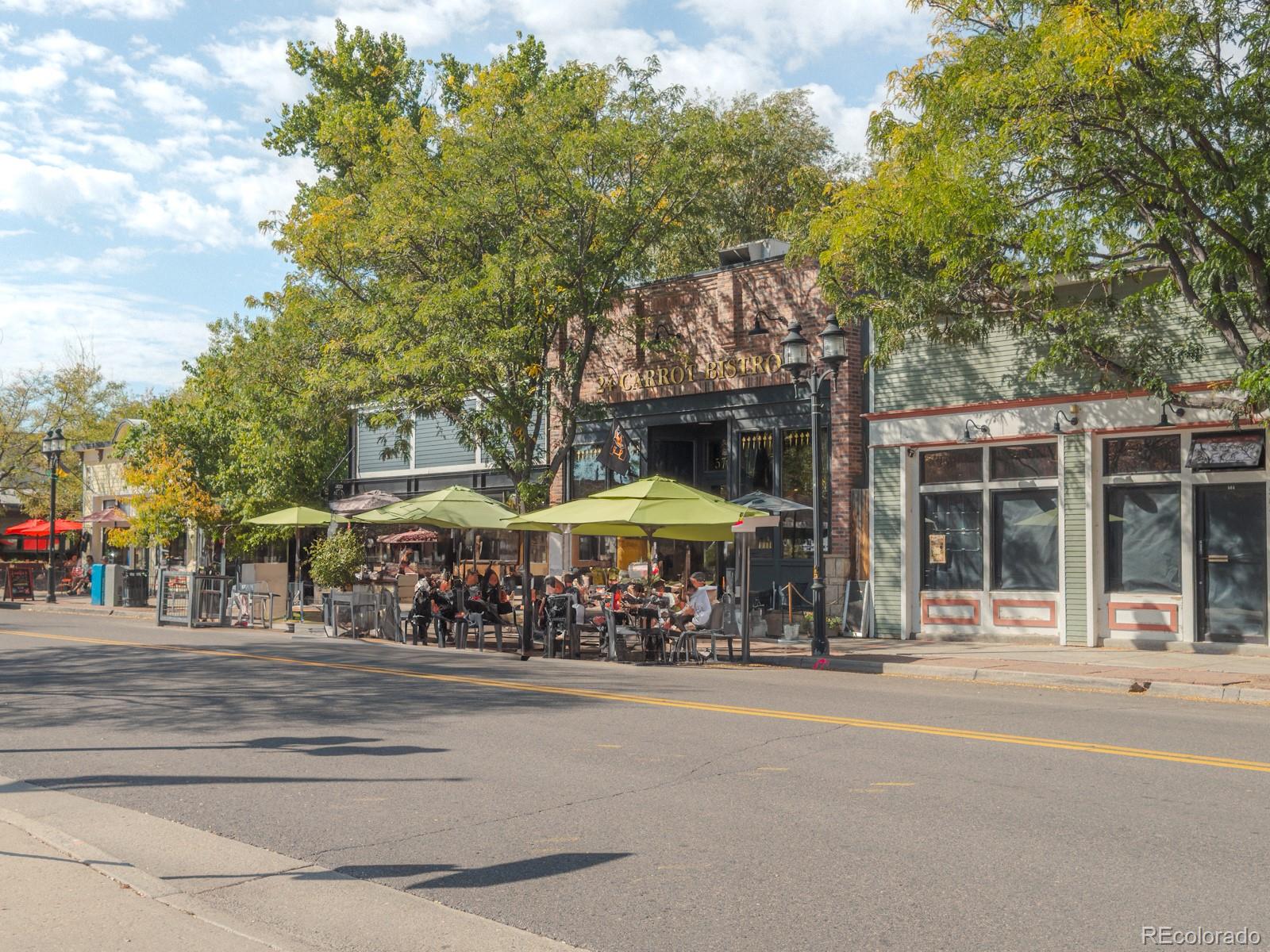 602 Mathews Way Erie, CO 80516 - Photo 48 of 50 a street with a building and trees in the background