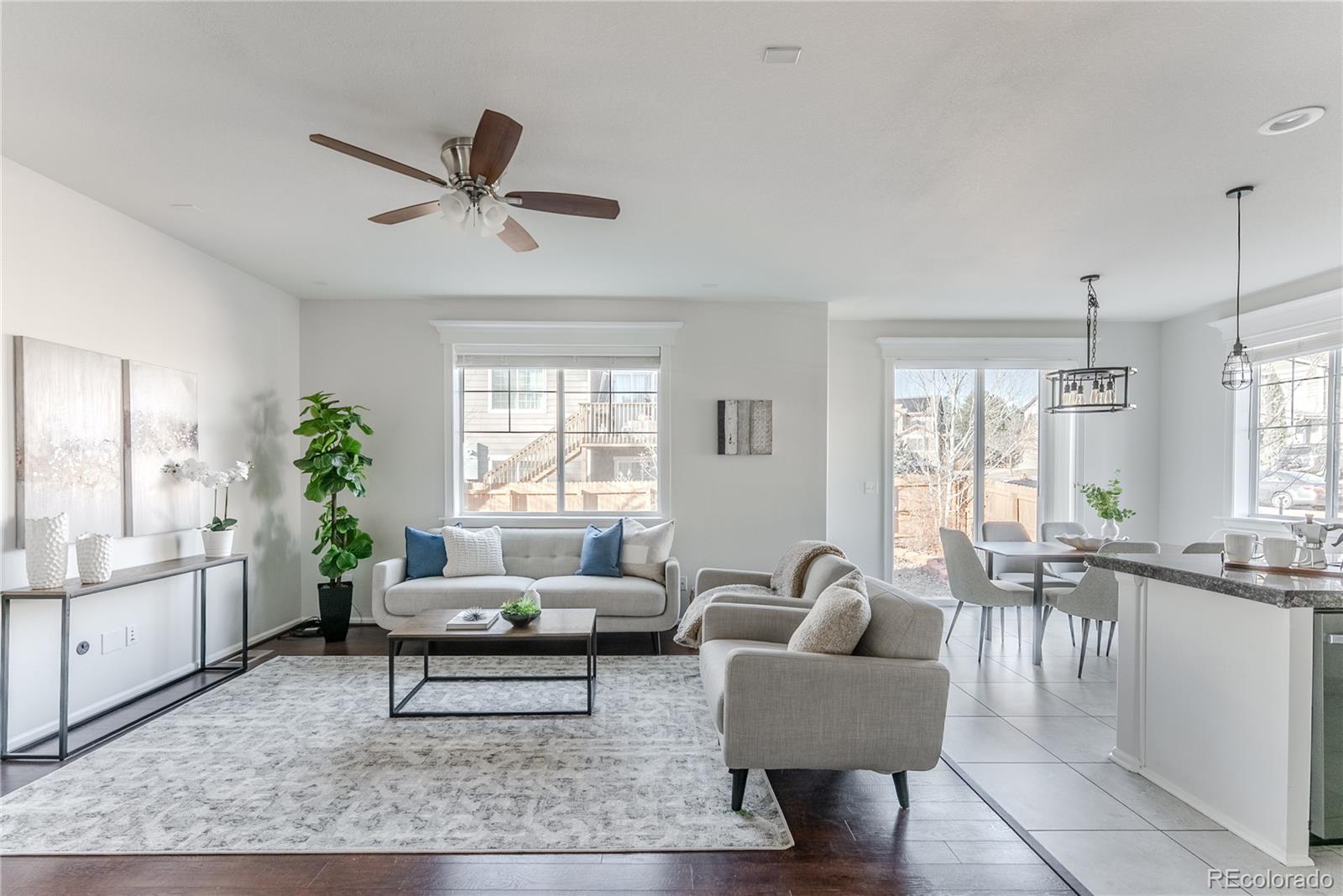 602 Mathews Way Erie, CO 80516 - Photo 5 of 50 a living room with furniture and a large window