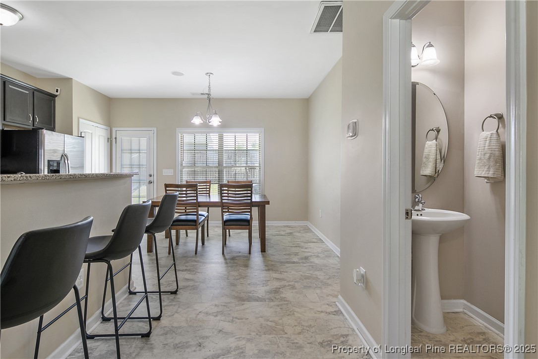 21 Bicentennial Way Cameron, NC 28326 - Photo 12 of 50 a view of a dining room with furniture