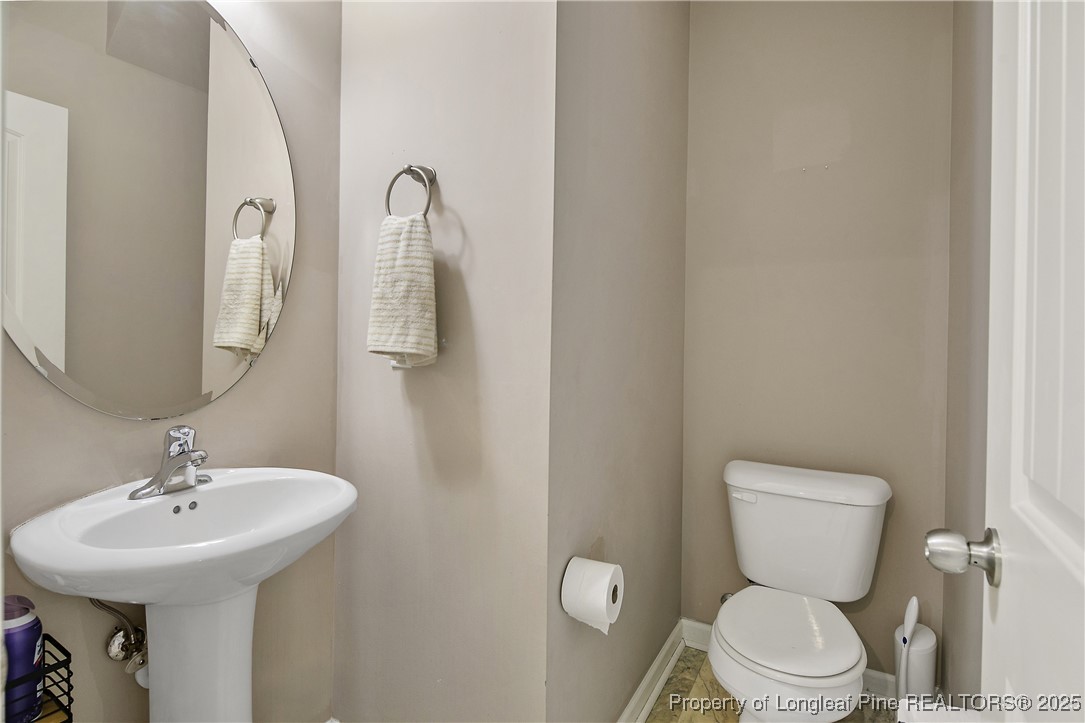 21 Bicentennial Way Cameron, NC 28326 - Photo 14 of 50 a bathroom with a toilet sink and mirror