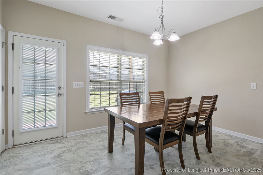 21 Bicentennial Way Cameron, NC 28326 - Photo 19 of 50 a dining room with furniture and window