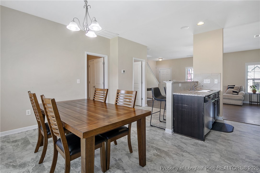 21 Bicentennial Way Cameron, NC 28326 - Photo 20 of 50 a dining room with furniture and wooden floor