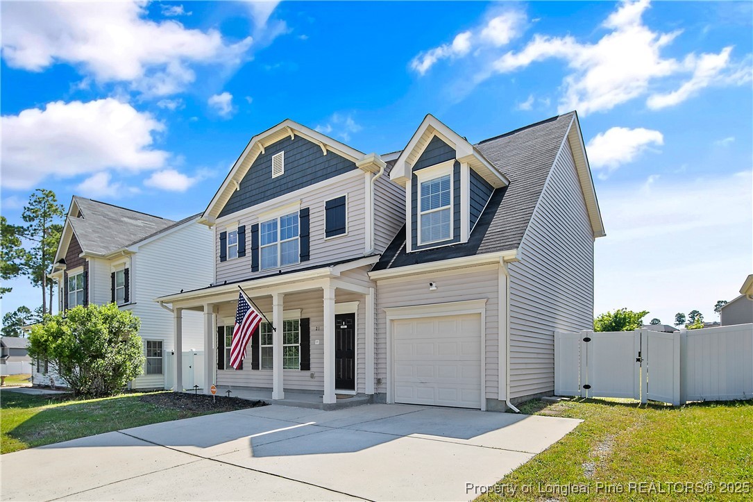 21 Bicentennial Way Cameron, NC 28326 - Photo 2 of 50 a front view of a house with a yard