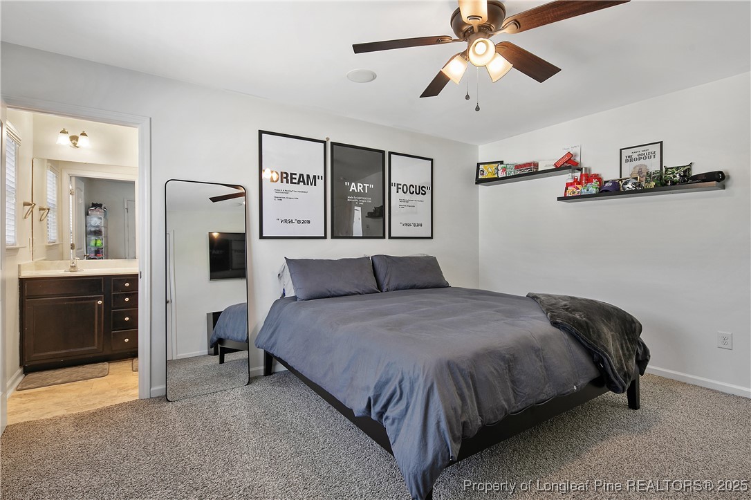 21 Bicentennial Way Cameron, NC 28326 - Photo 30 of 50 a bedroom with a bed and ceiling fan