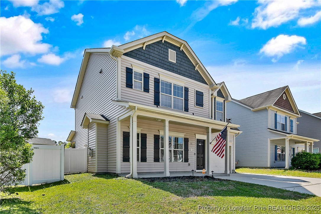 21 Bicentennial Way Cameron, NC 28326 - Photo 3 of 50 a front view of a house with a yard