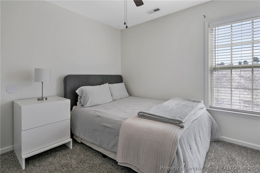 21 Bicentennial Way Cameron, NC 28326 - Photo 35 of 50 a bedroom with a bed and a window