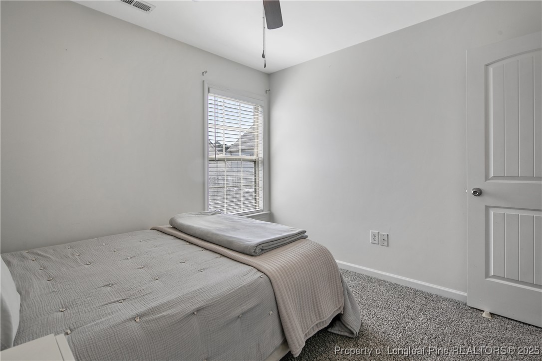 21 Bicentennial Way Cameron, NC 28326 - Photo 36 of 50 a bedroom with a bed and a window