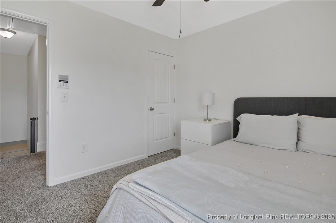 21 Bicentennial Way Cameron, NC 28326 - Photo 37 of 50 a bedroom with a bed and a night stand