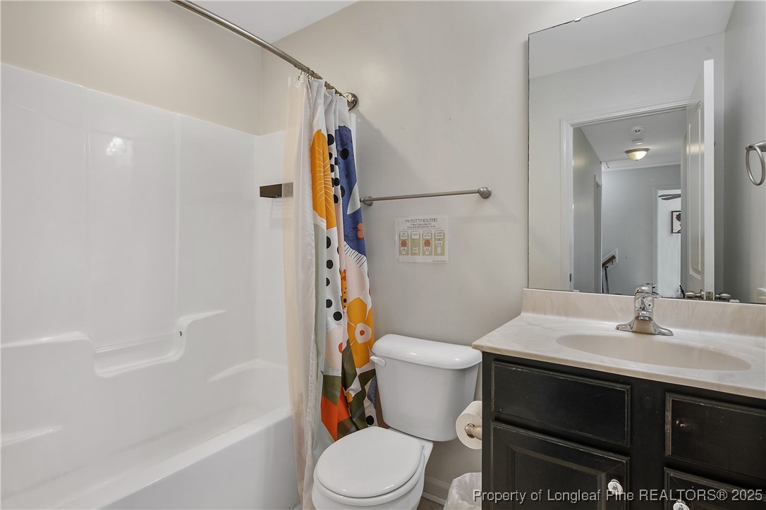 21 Bicentennial Way Cameron, NC 28326 - Photo 38 of 50 a bathroom with a sink a toilet and shower
