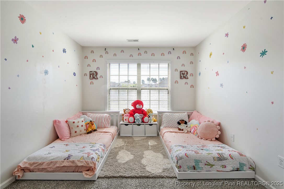 21 Bicentennial Way Cameron, NC 28326 - Photo 45 of 50 a bedroom with a bed and window