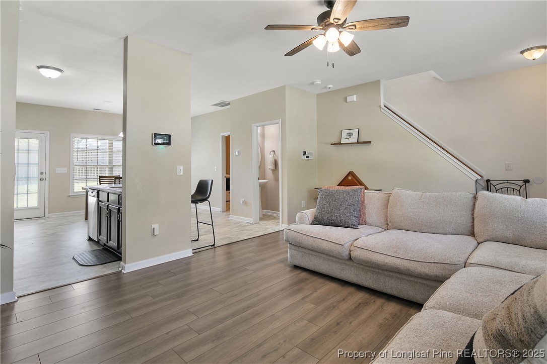 21 Bicentennial Way Cameron, NC 28326 - Photo 7 of 50 a living room with furniture and a chandelier