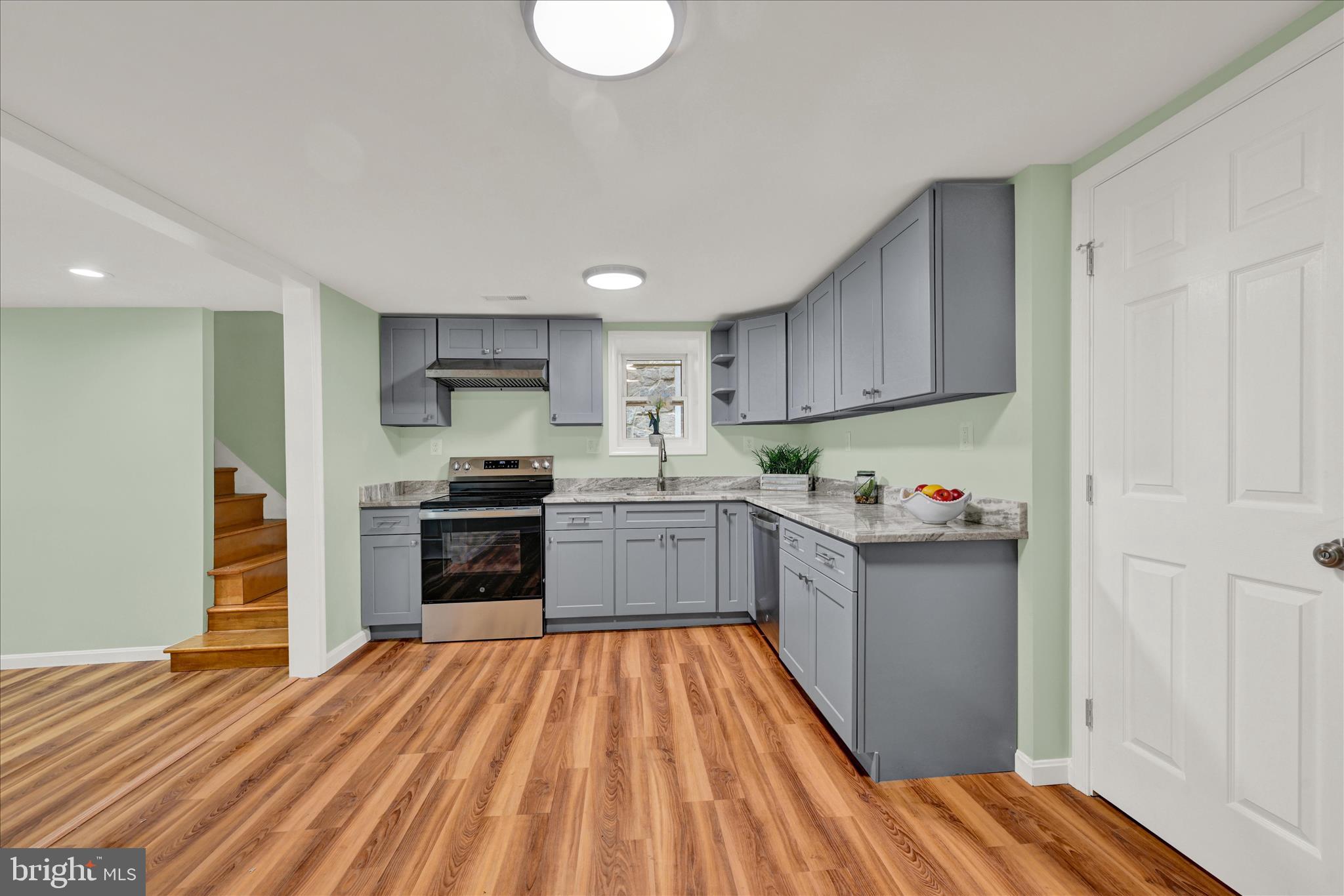 8511 Frederick Road Ellicott City, MD 21043 - Photo 7 of 36 a kitchen with granite countertop stainless steel appliances and wooden cabinets