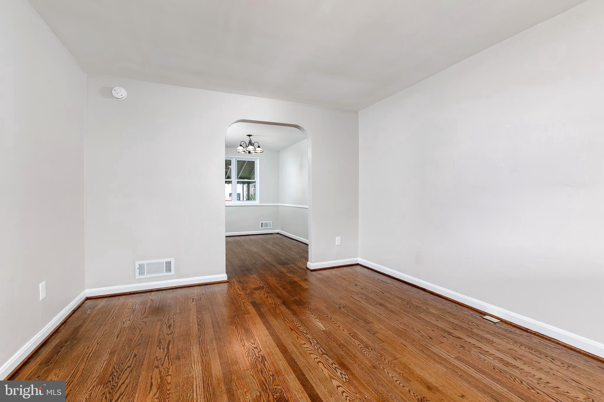 7720 Wynbrook Road Baltimore, MD 21224 - Photo 6 of 25 Living area opens to dining room