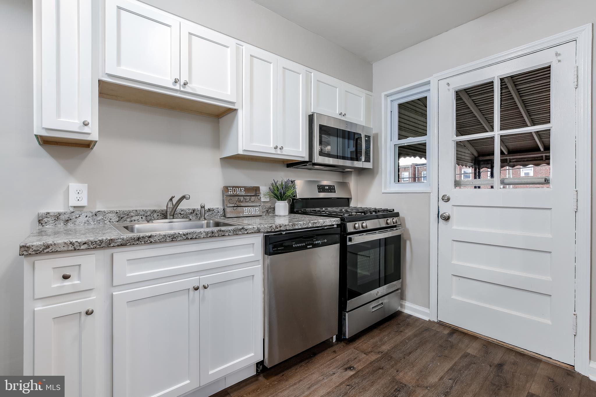7720 Wynbrook Road Baltimore, MD 21224 - Photo 7 of 25 Brand new kitchen opens to back porch