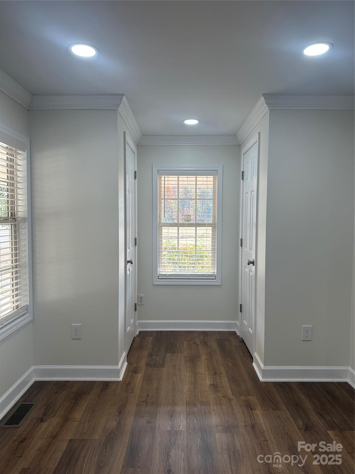 8225 Linwood-Southmont Road Lexington, NC 27292 - Photo 10 of 30 an empty room with wooden floor and windows