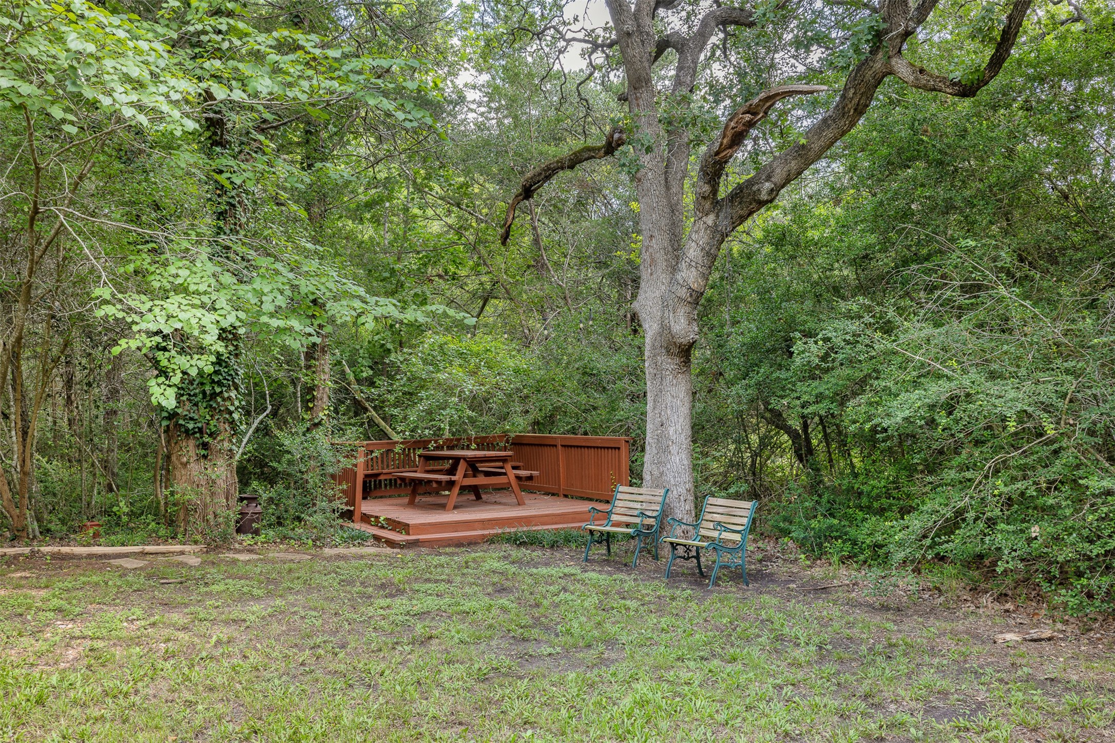 10900 Mayer Cemetery Road Burton, TX 77835 - Photo 24 of 24 a backyard of a house with trees and outdoor seating