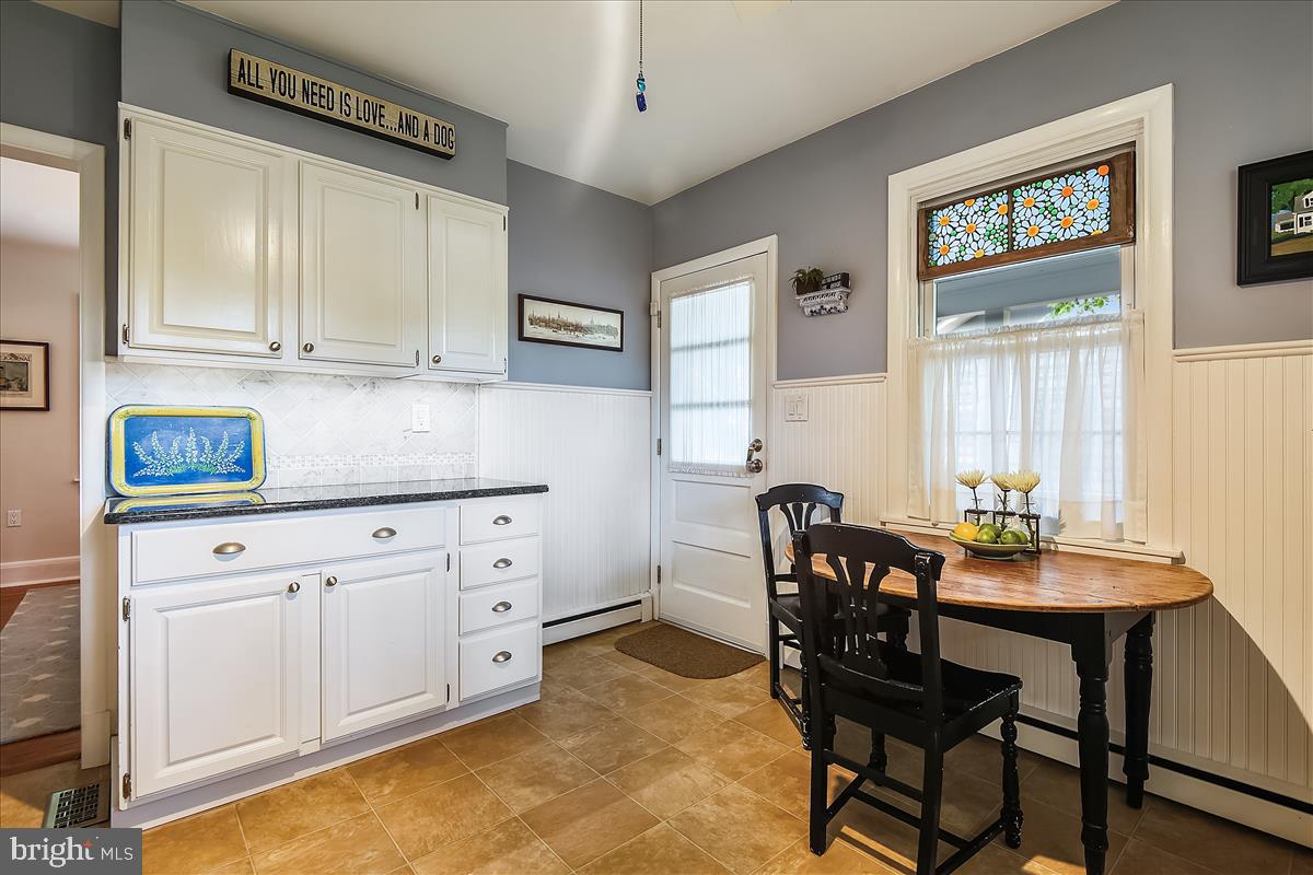 221 Gibson Road Annapolis, MD 21401 - Photo 14 of 58 Lots of cabinet space. Kitchen opens to side porch