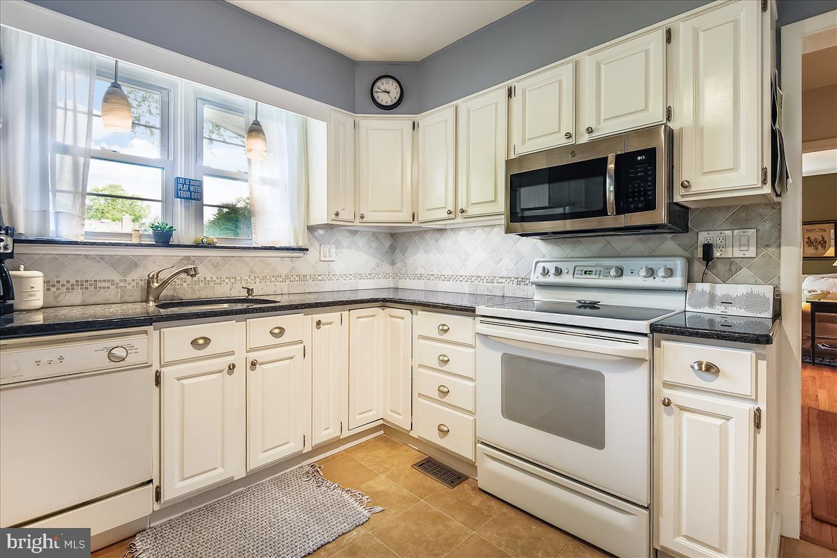 221 Gibson Road Annapolis, MD 21401 - Photo 15 of 58 Kitchen windows offer views of private backyard