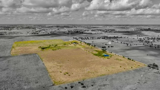 a view of swimming pool with a yard
