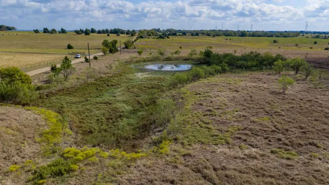 a view of a lake with houses in the back