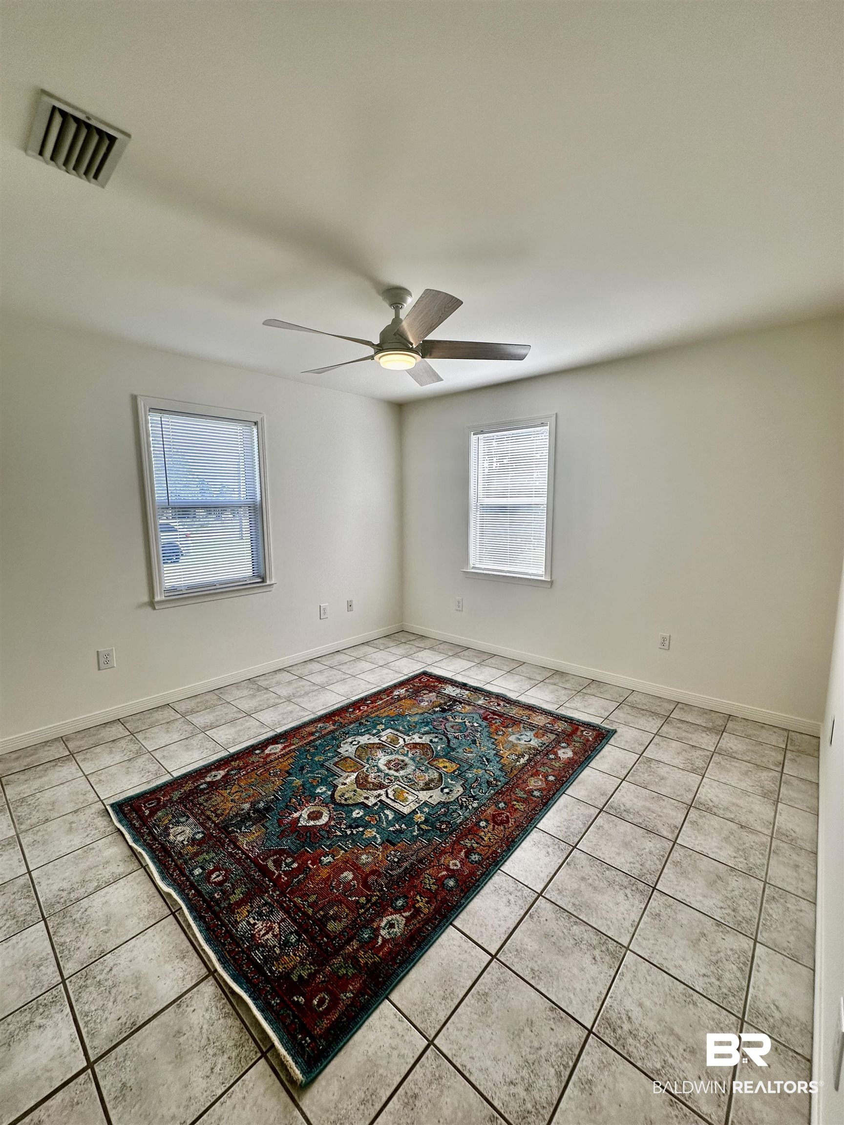 9090 Bay Pnes Road Elberta, AL 36530 - Photo 17 of 26 Tiled spare room featuring ceiling fan