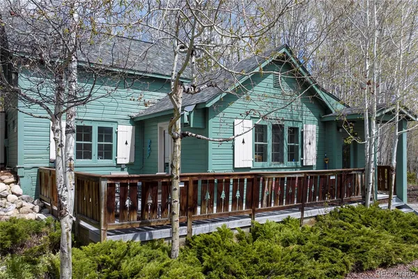 front view of a house with wooden fence