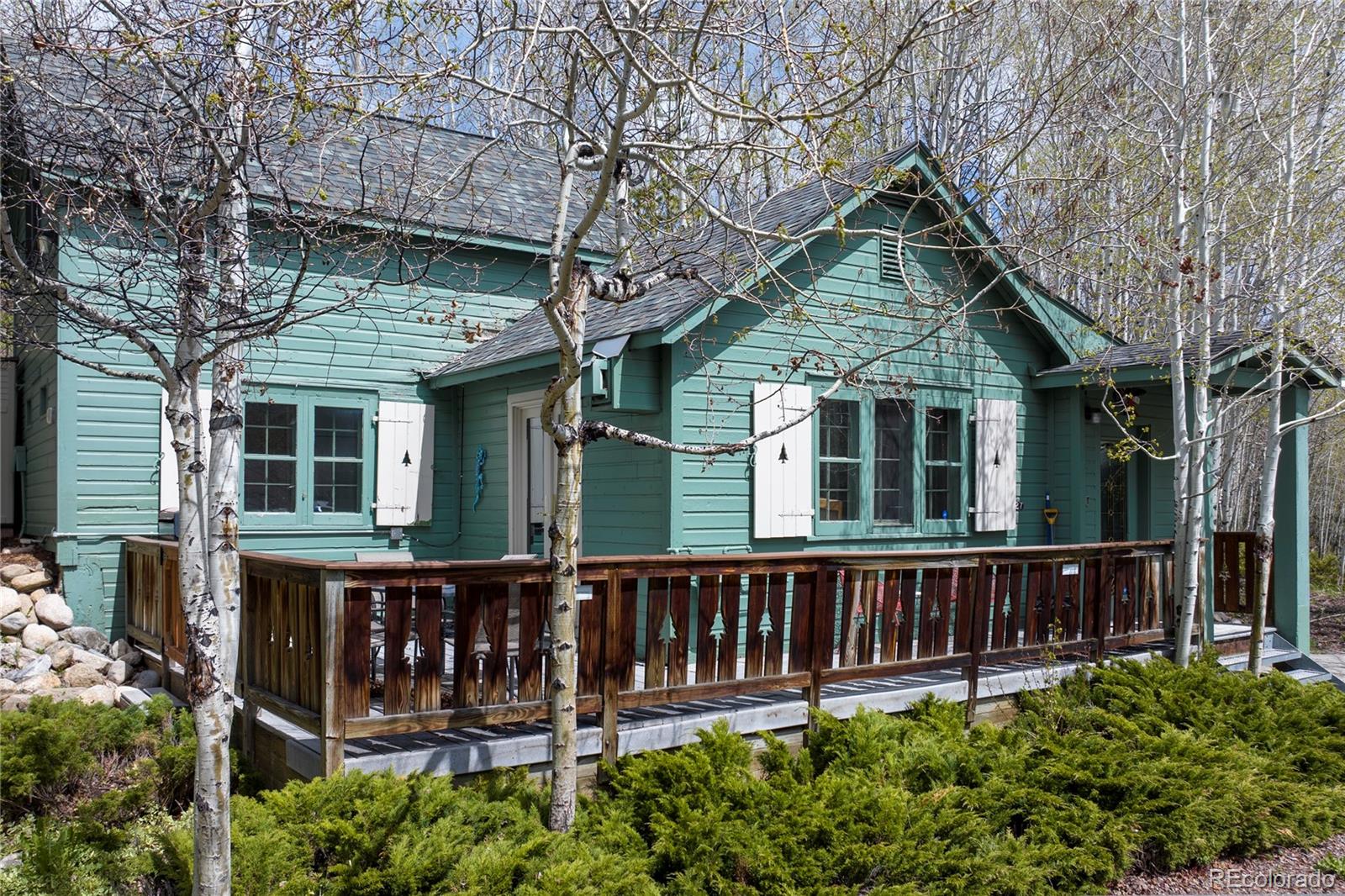 front view of a house with wooden fence