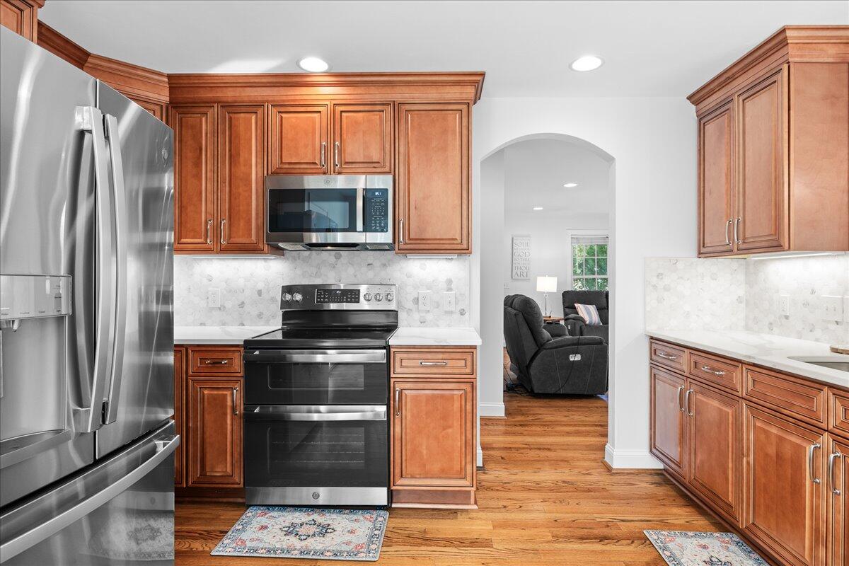 1695 Red Ln Extension Salem, VA 24153 - Photo 12 of 41 a kitchen with granite countertop a stove top oven and refrigerator