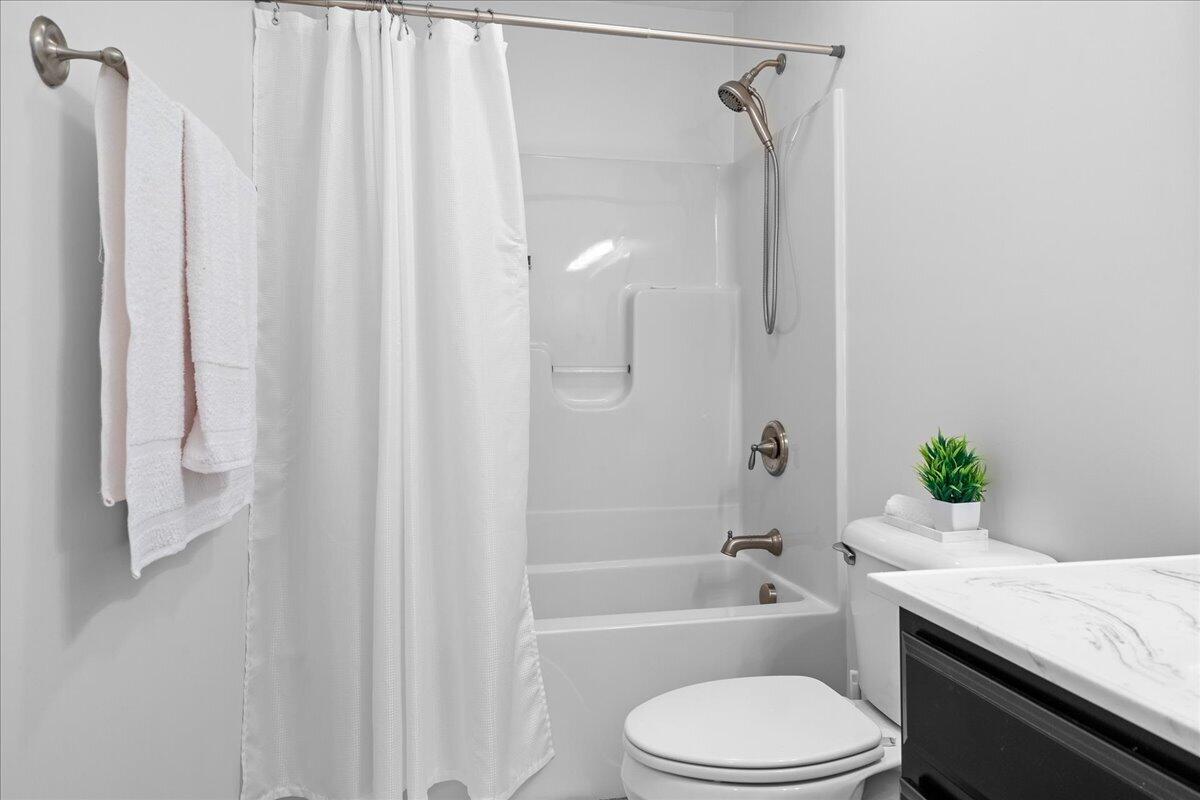 1695 Red Ln Extension Salem, VA 24153 - Photo 22 of 41 a bathroom with a granite countertop sink toilet and shower