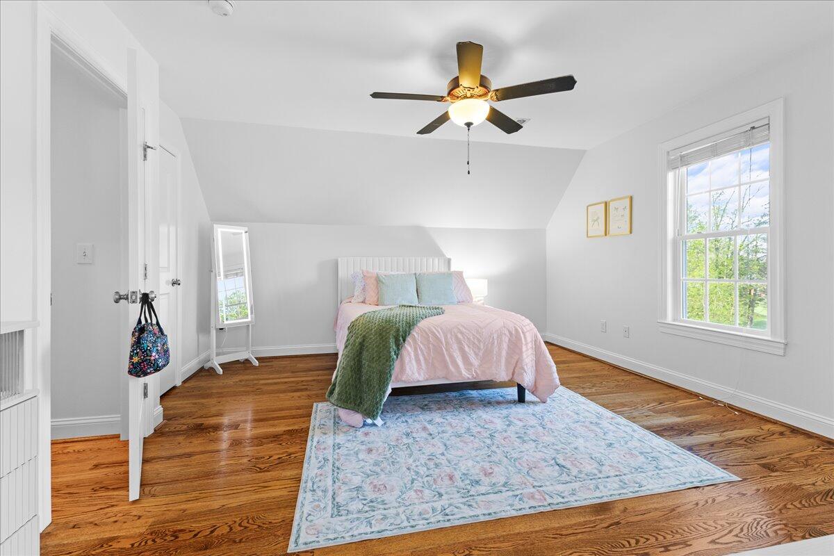 1695 Red Ln Extension Salem, VA 24153 - Photo 29 of 41 a bedroom with a bed and wooden floor