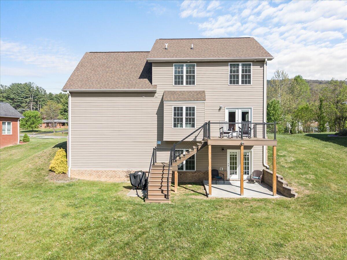 1695 Red Ln Extension Salem, VA 24153 - Photo 39 of 41 a white house that has a small yard and couches chairs with wooden fence