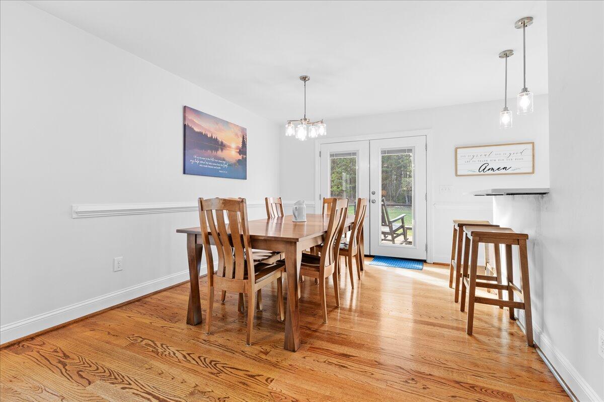 1695 Red Ln Extension Salem, VA 24153 - Photo 7 of 41 a view of a dining room with furniture and wooden floor