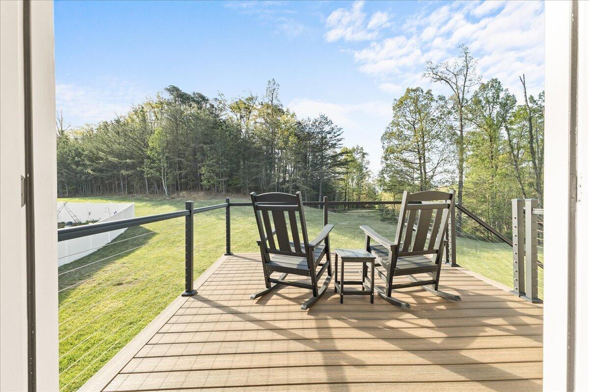 1695 Red Ln Extension Salem, VA 24153 - Photo 9 of 41 a view of a balcony with chairs and wooden floor
