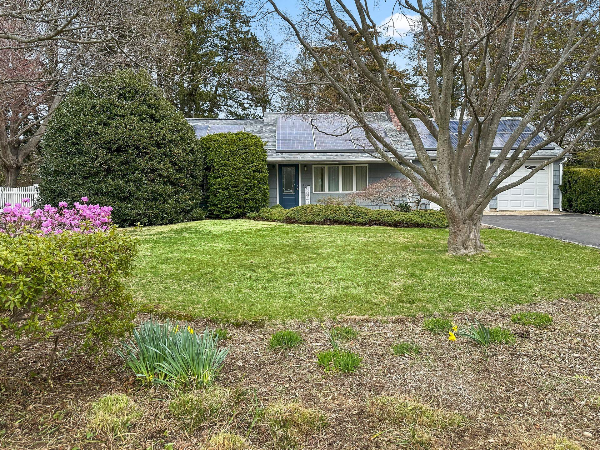 1 Upper Lane Centerport, NY 11721 - Photo 1 of 1 a view of a house with a garden