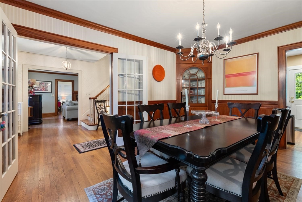 114 South Border Road Medford, MA 02155 - Photo 12 of 36 a view of a dining room with furniture and chandelier