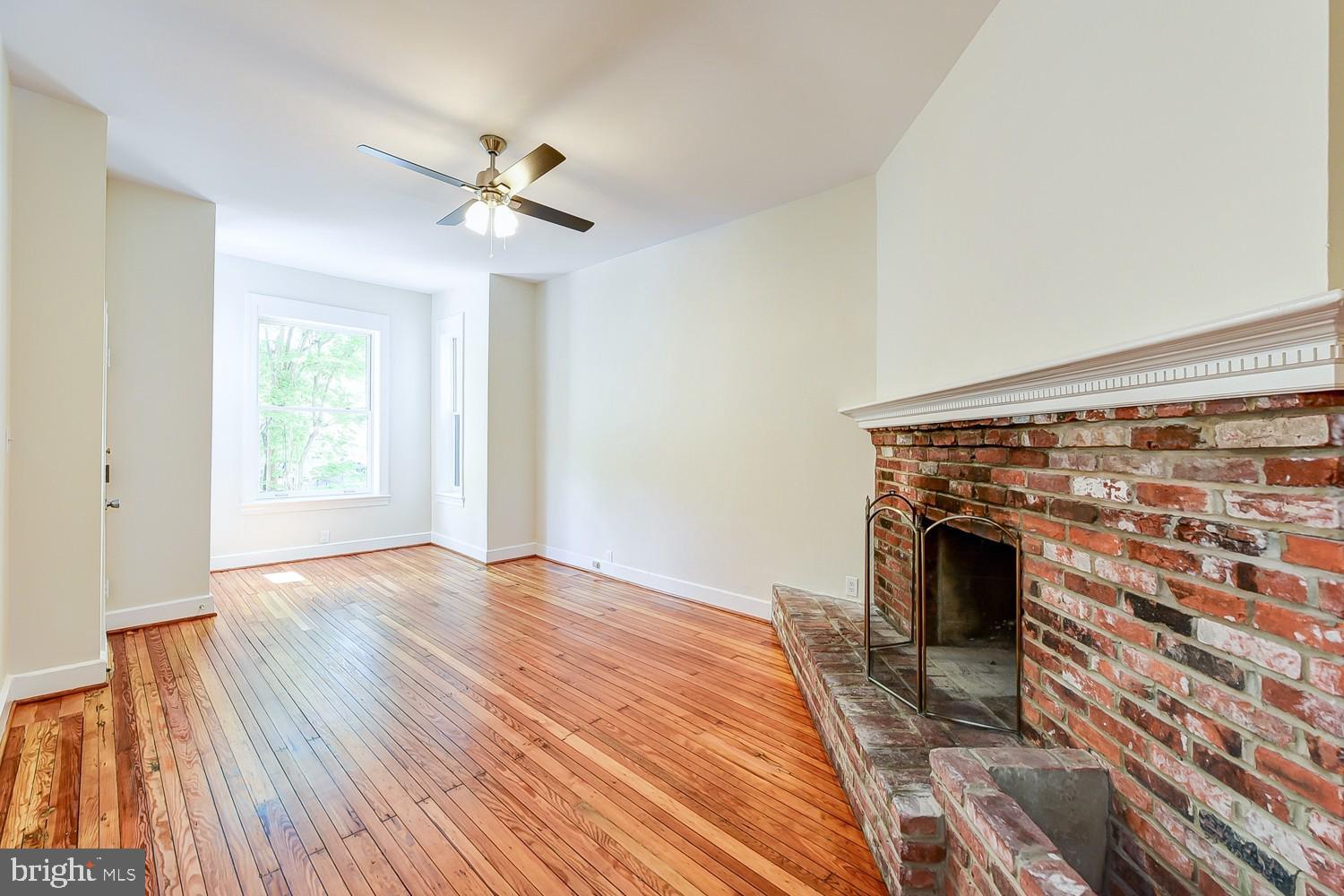 1307 22nd Street Northwest Washington, DC 20037 - Photo 16 of 46 a view of empty room with wooden floor and fan