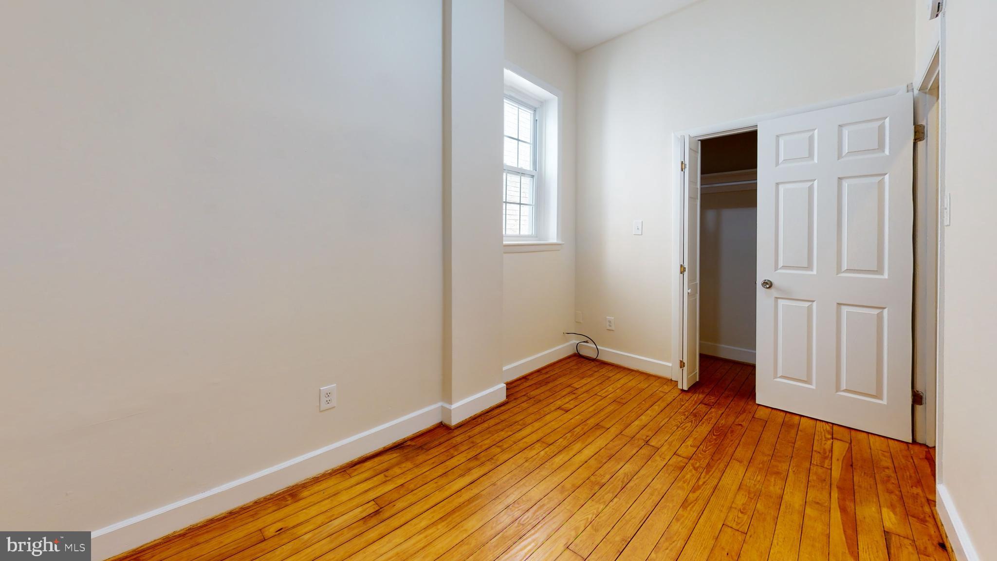 1307 22nd Street Northwest Washington, DC 20037 - Photo 26 of 46 a view of a room with wooden floor and gate