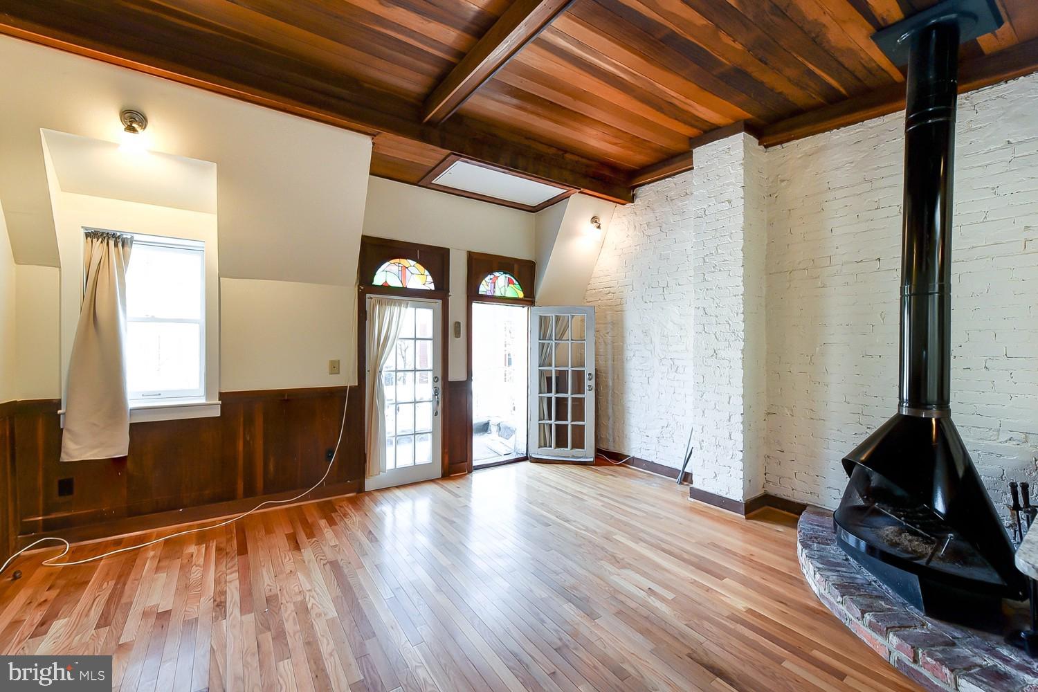 1307 22nd Street Northwest Washington, DC 20037 - Photo 32 of 46 a view of an empty room with wooden floor and a window