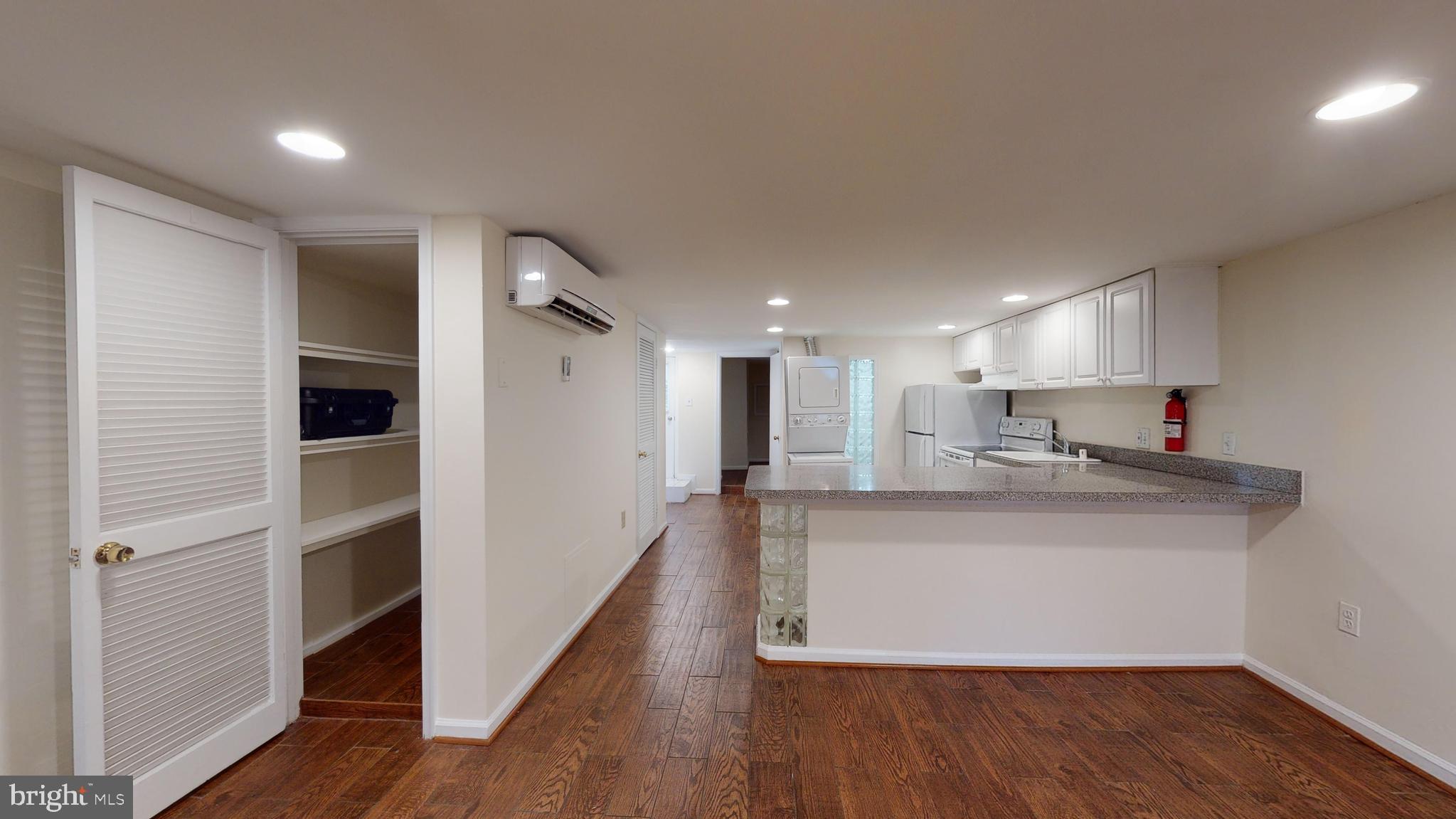 1307 22nd Street Northwest Washington, DC 20037 - Photo 40 of 46 a view of kitchen with cabinets and wooden floor