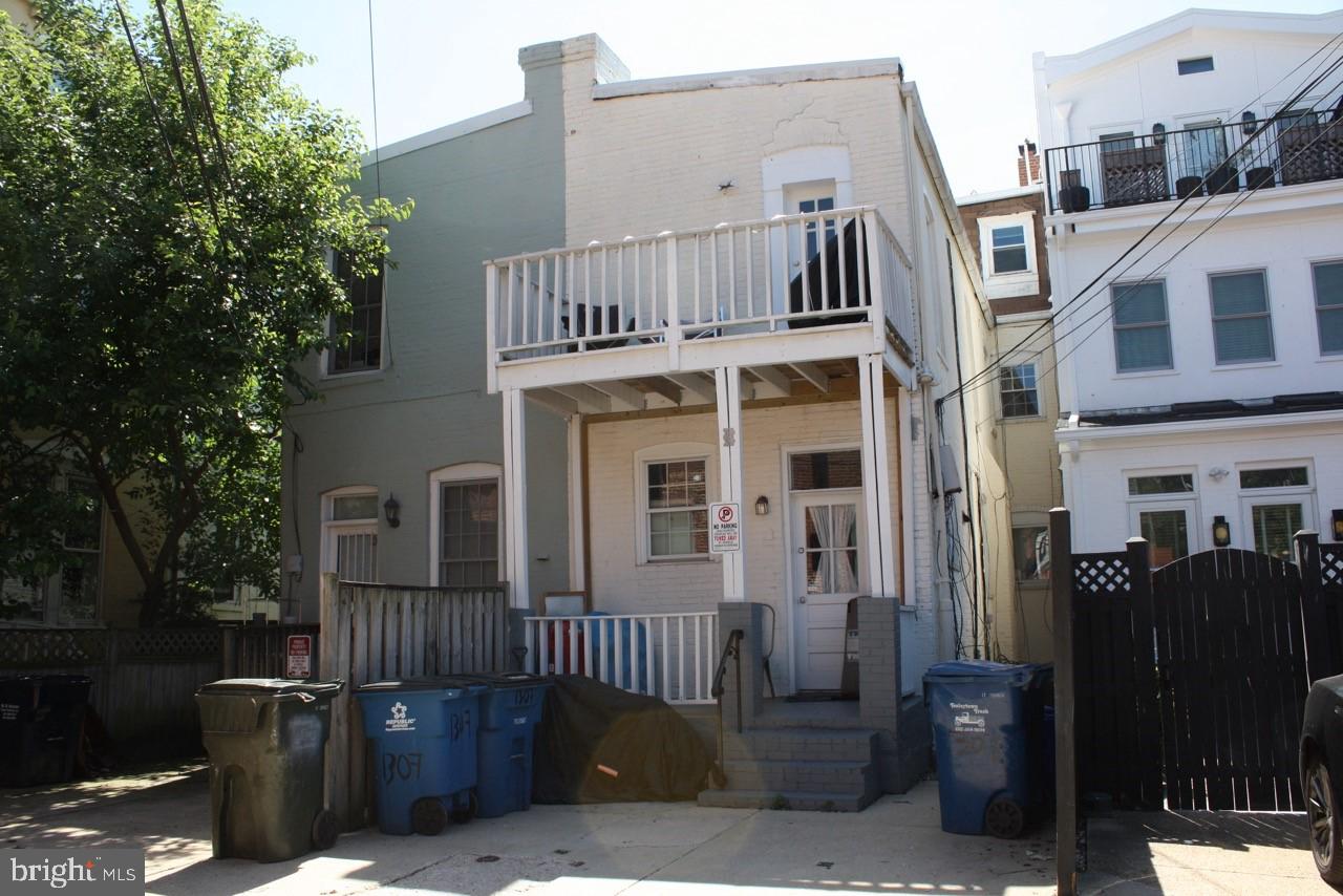 1307 22nd Street Northwest Washington, DC 20037 - Photo 45 of 46 a view of a brick building next to a yard