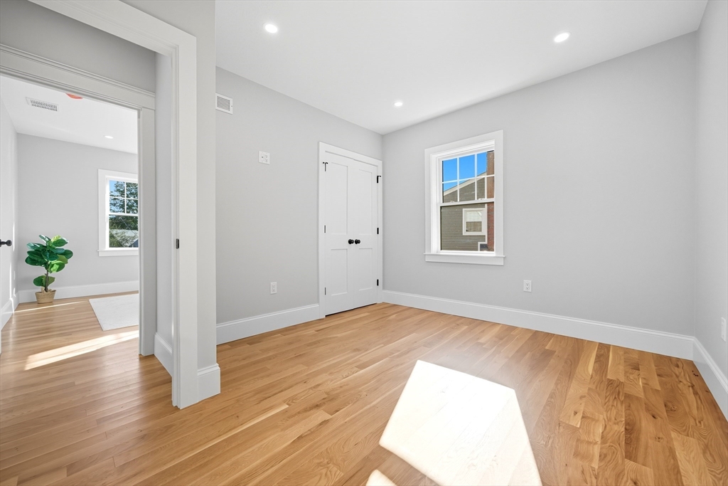 6 Ivy Circle Winchester, MA 01890 - Photo 11 of 40 a view of an empty room and wooden floor