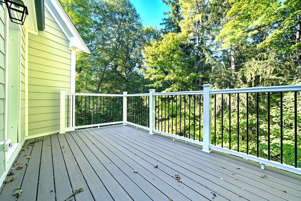 6 Ivy Circle Winchester, MA 01890 - Photo 17 of 40 a view of balcony with wooden floor