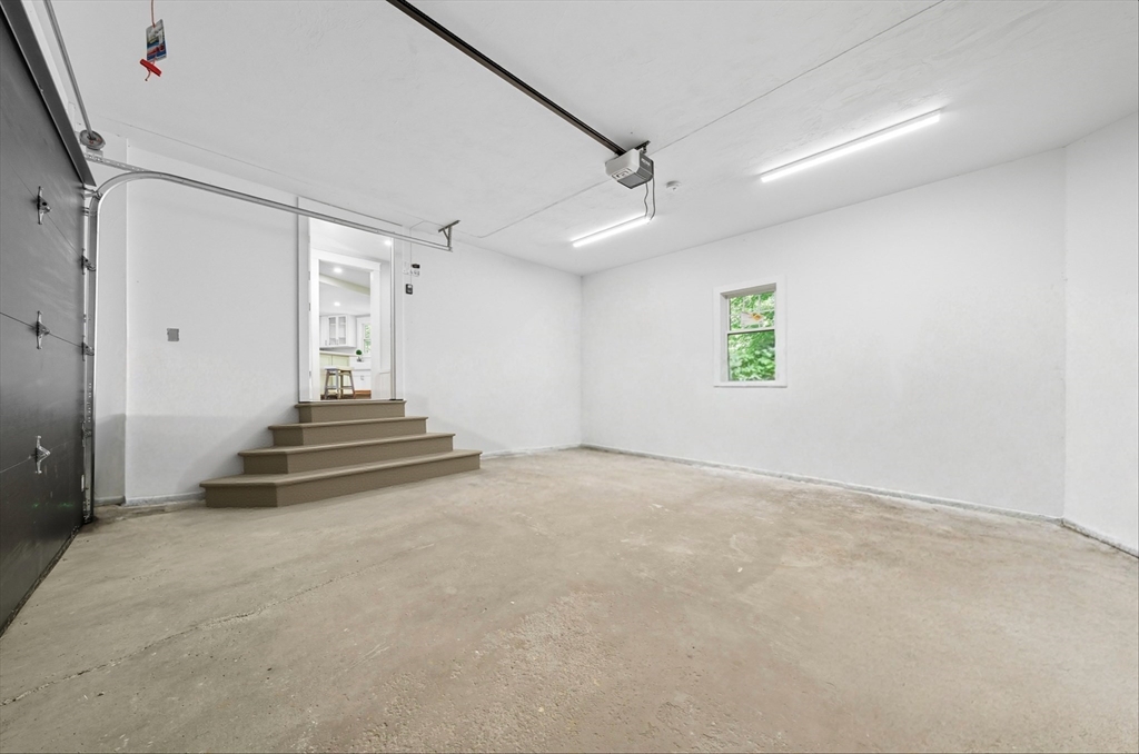 6 Ivy Circle Winchester, MA 01890 - Photo 31 of 40 a view of a livingroom with wooden floor and a ceiling fan