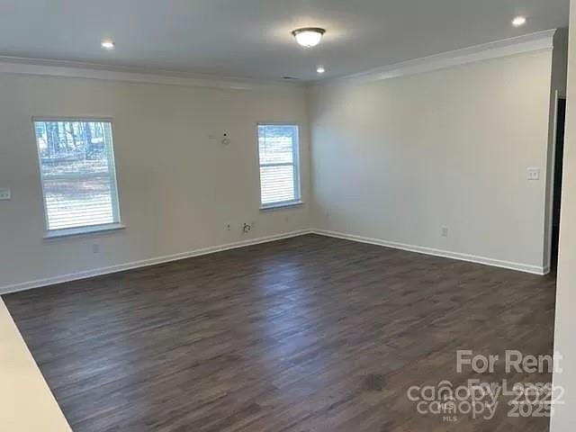 6100 Trinity Xing Circle Kannapolis, NC 28081 - Photo 7 of 25 an empty room with wooden floor and windows