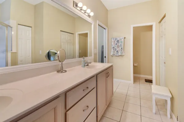 a bathroom with a sink a vanity and a mirror