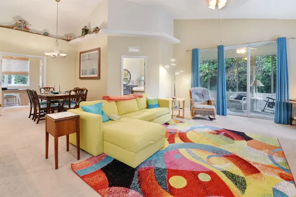 a living room filled with furniture and a table
