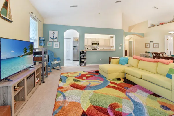 a bedroom with a bed and a couch