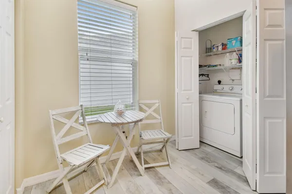 a view of a room that has a bed and a bookshelf in it