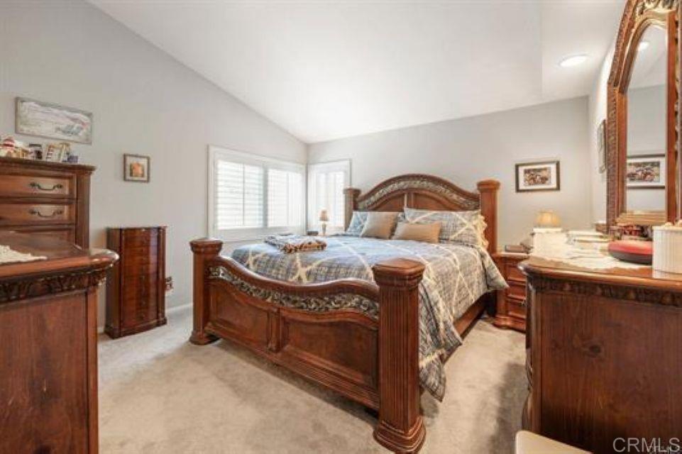 2277 Dunstan Street Oceanside, CA 92054 - Photo 16 of 36 a bedroom with a bed and a dresser