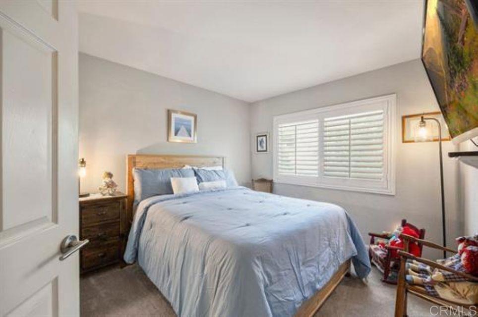 2277 Dunstan Street Oceanside, CA 92054 - Photo 19 of 36 a bedroom with a bed and a window
